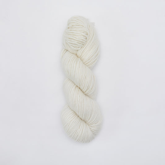 Kinua The Skinny Luxury Blend yarn in soft, creamy milk color, showcasing smooth, high-quality knitting yarn texture.