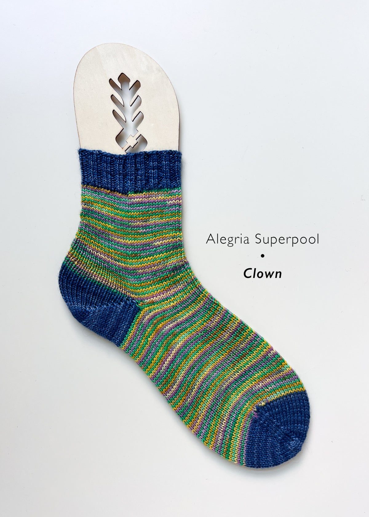 Fairmount Fibers Alegria Superpool kit featuring a colorful clown design on the package, used for fiber arts and craft projects.