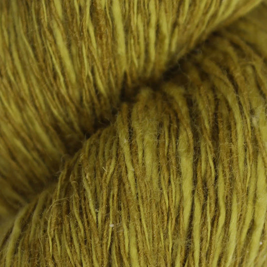 Antique Baa Ram Ewe linen yarn ball showcasing soft, textured linseed fiber in natural shades for knitting or crafting.