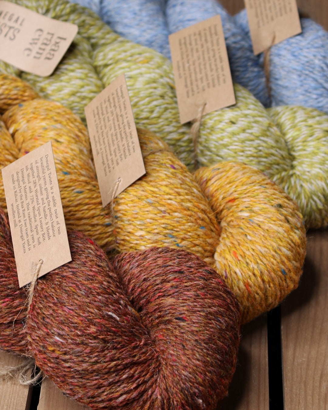 Baa Ram Ewe Donegal Twists yarn in natural wool with colorful flecks, ideal for knitting and crochet projects.
