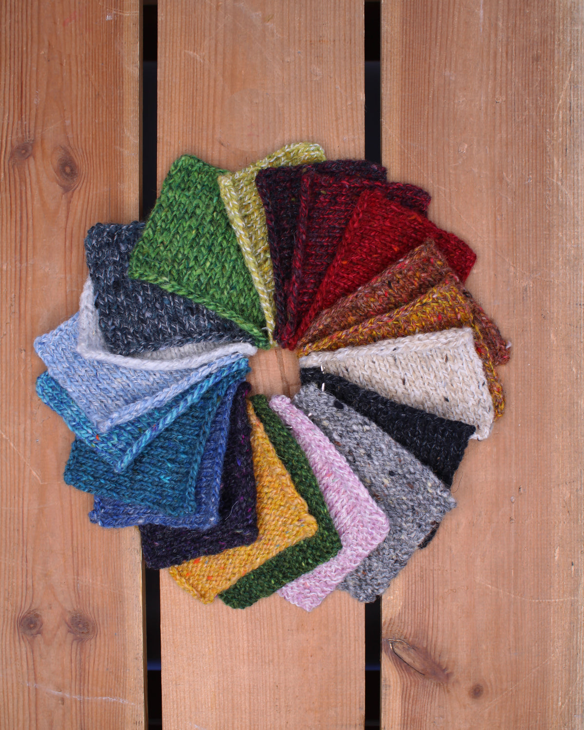 Colorful Donegal Twists yarn swatches by Baa Ram Ewe showcasing their textured, multicolored wool yarn in various shades.