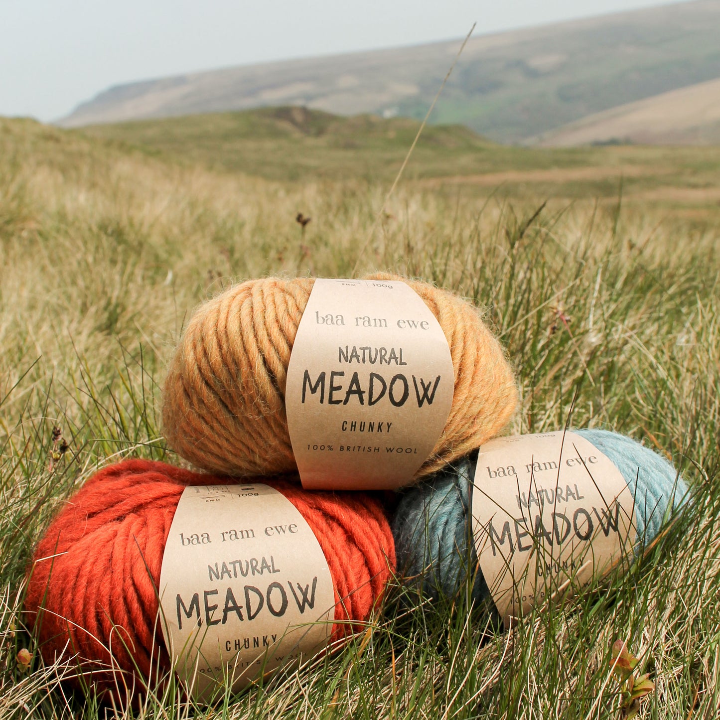 Natural Baa Ram Ewe Meadow yarn in soft, neutral tones, showcasing its textured wool fibers.
