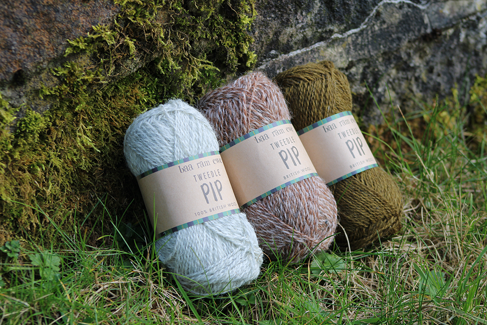 Baa Ram Ewe Tweedle Pip yarn in soft, colorful wool with a textured, variegated appearance perfect for knitting projects.