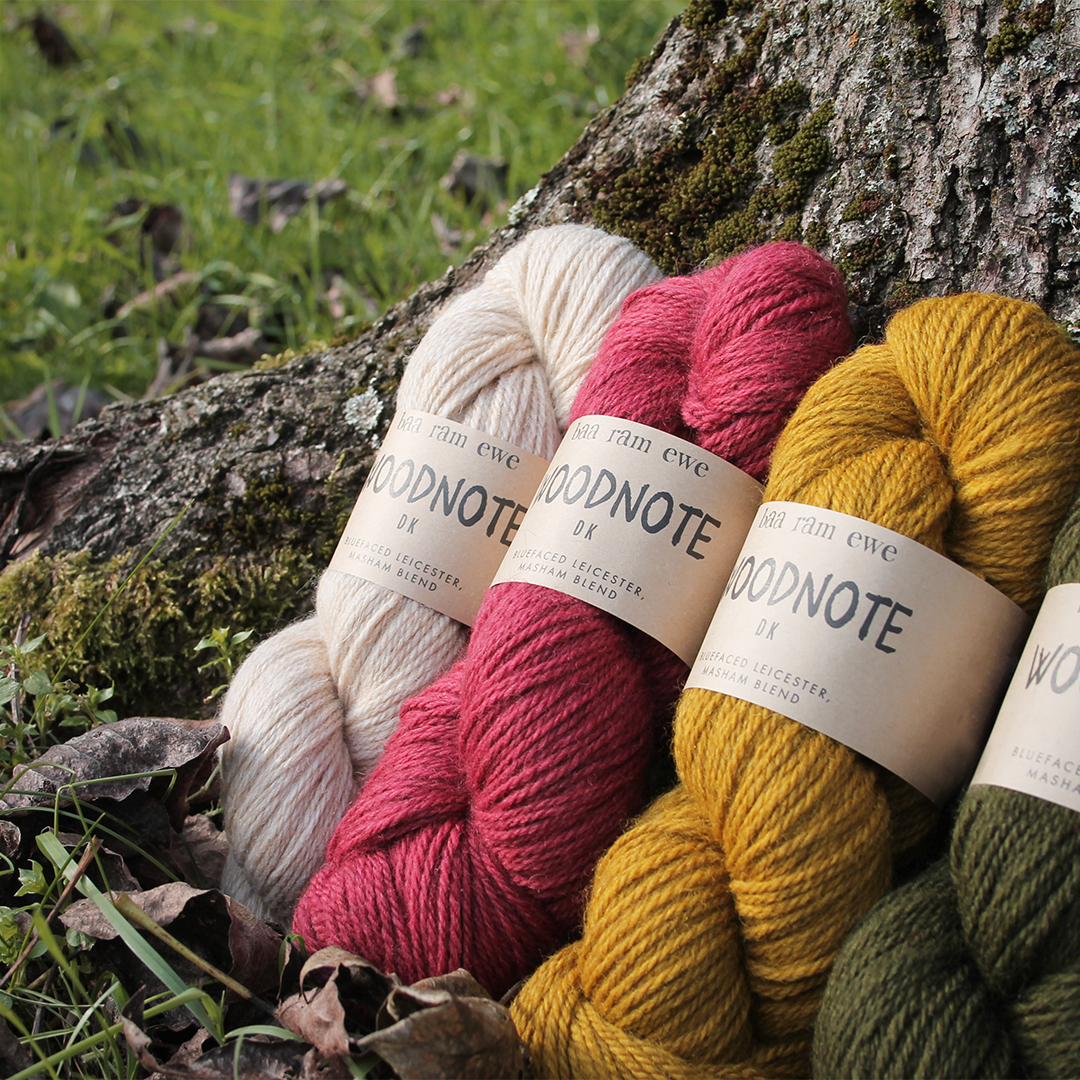 Baa Ram Ewe Woodnote DK yarn ball in natural wood tone, showcasing soft, twisted wool yarn for knitting and crochet projects.