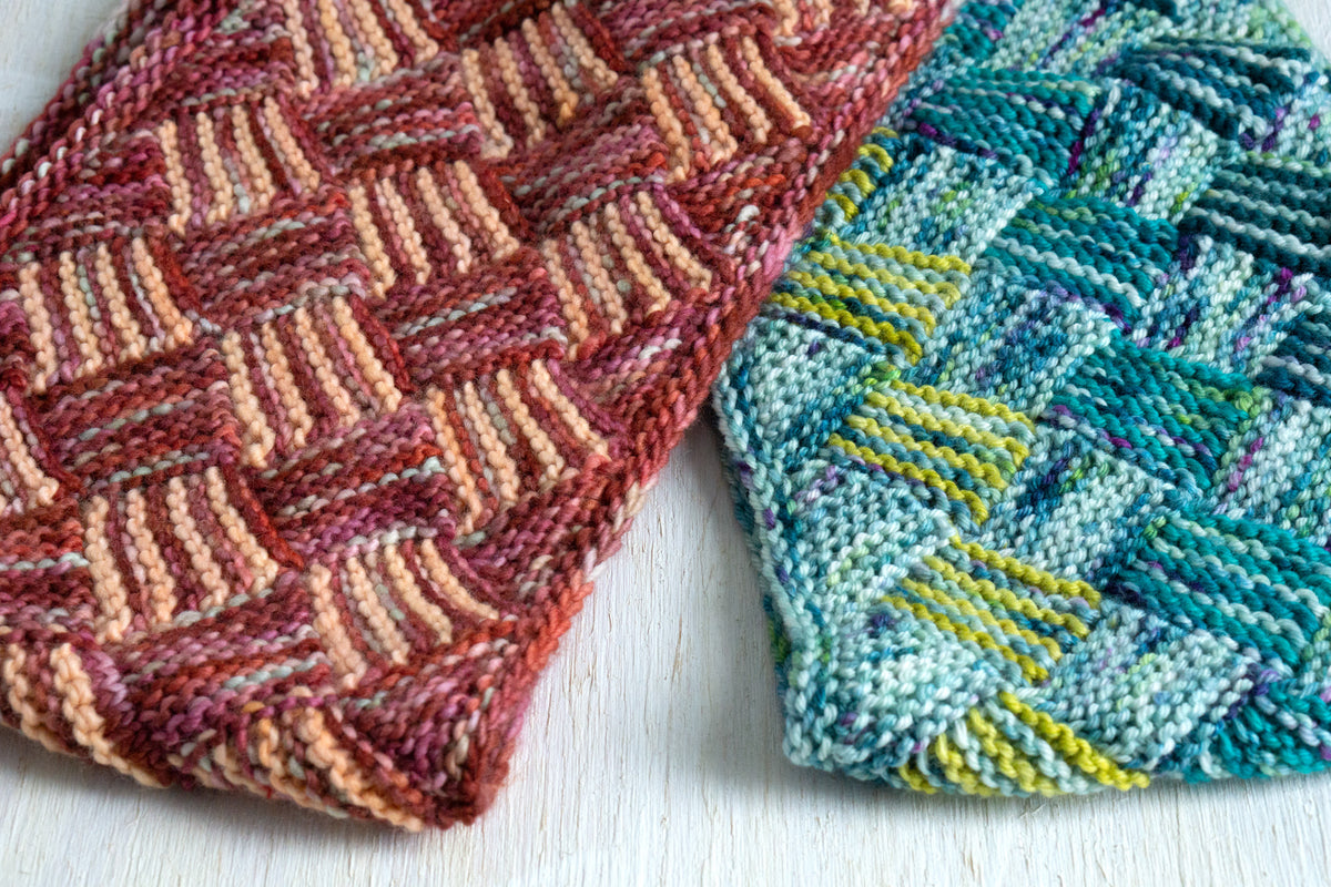 Fairmount Fibers Rise and Run Maxima pattern yarn in shades of blue and gray, displayed in a close-up shot.