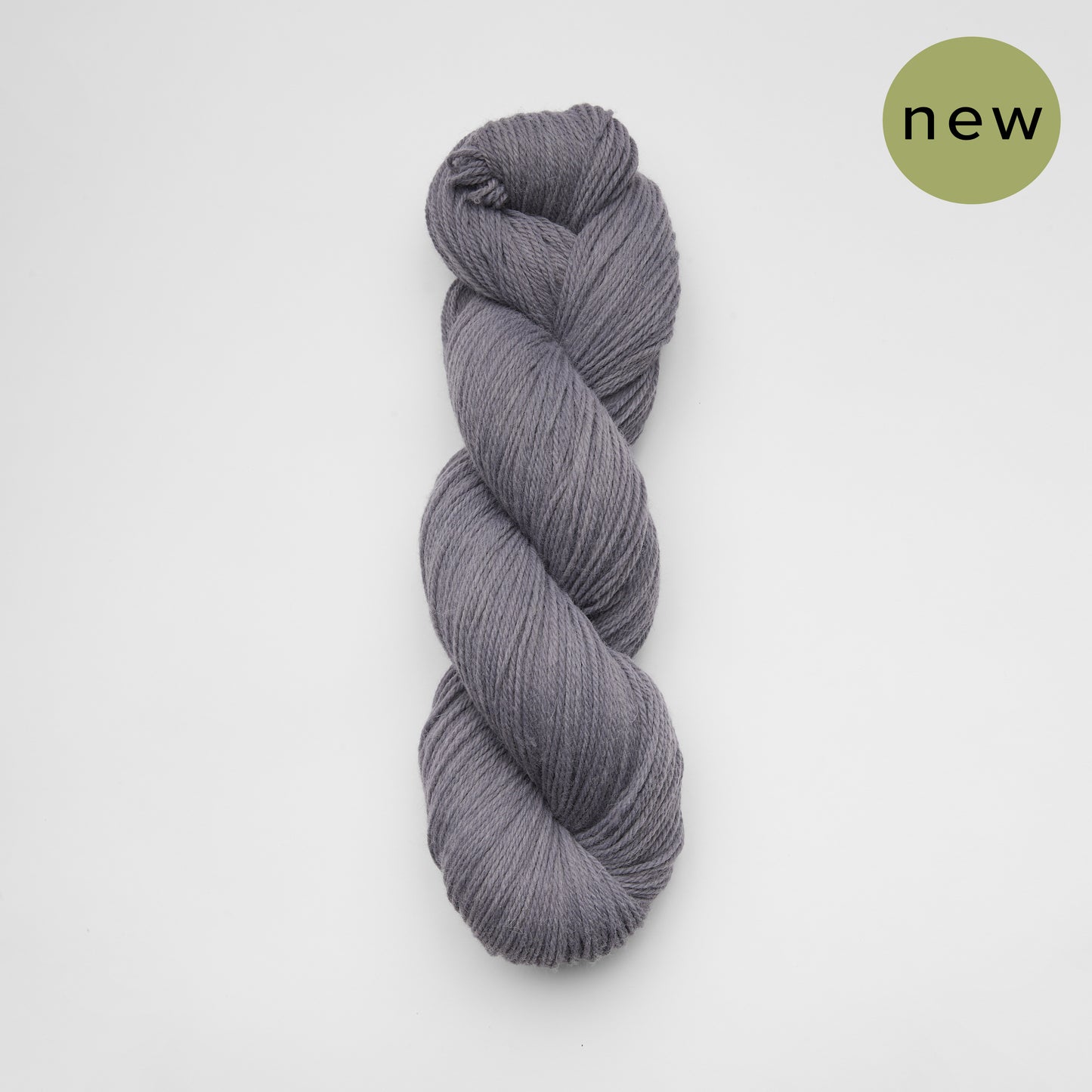 Kinua Fingering Luxury Blend yarn in 126 Charcoal, soft and vibrant fingering weight yarn for knitting and crochet projects.