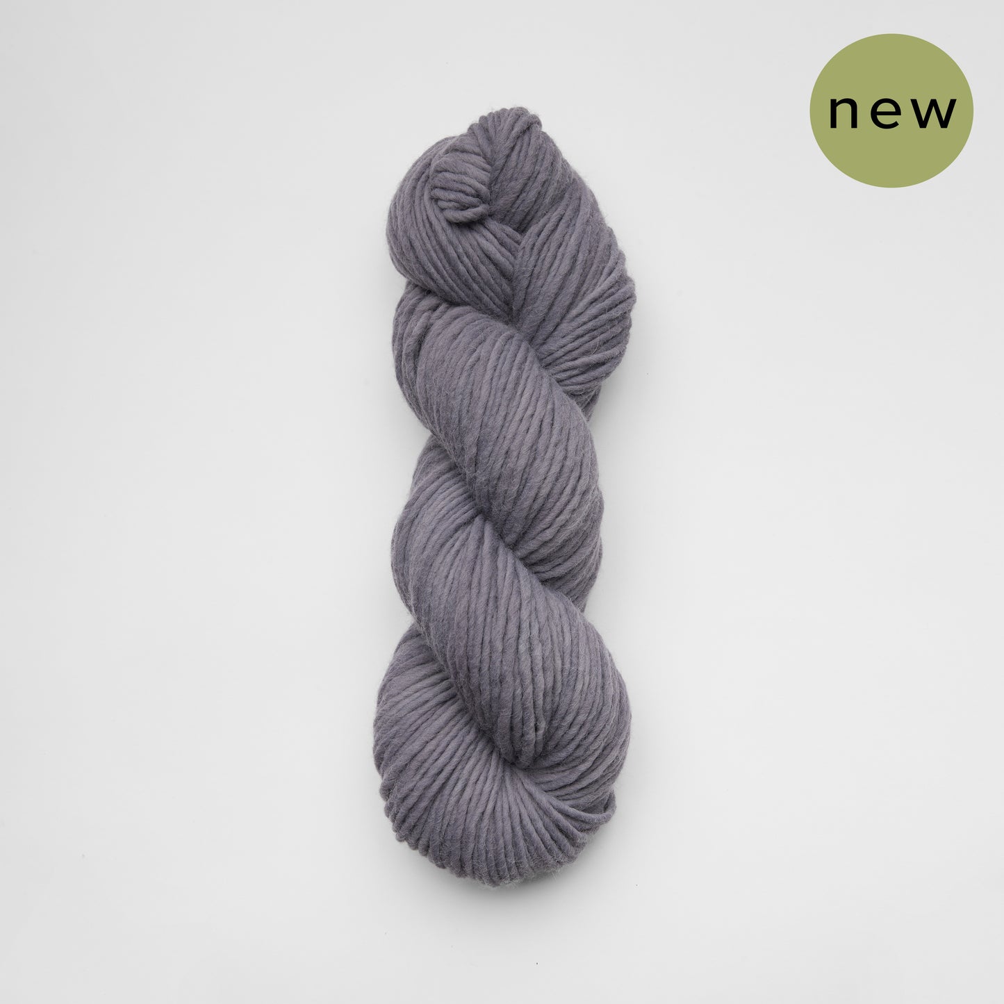 Kinua The Skinny Luxury Blend yarn in charcoal with a soft, smooth texture and fine gauge for knitting and crochet projects.