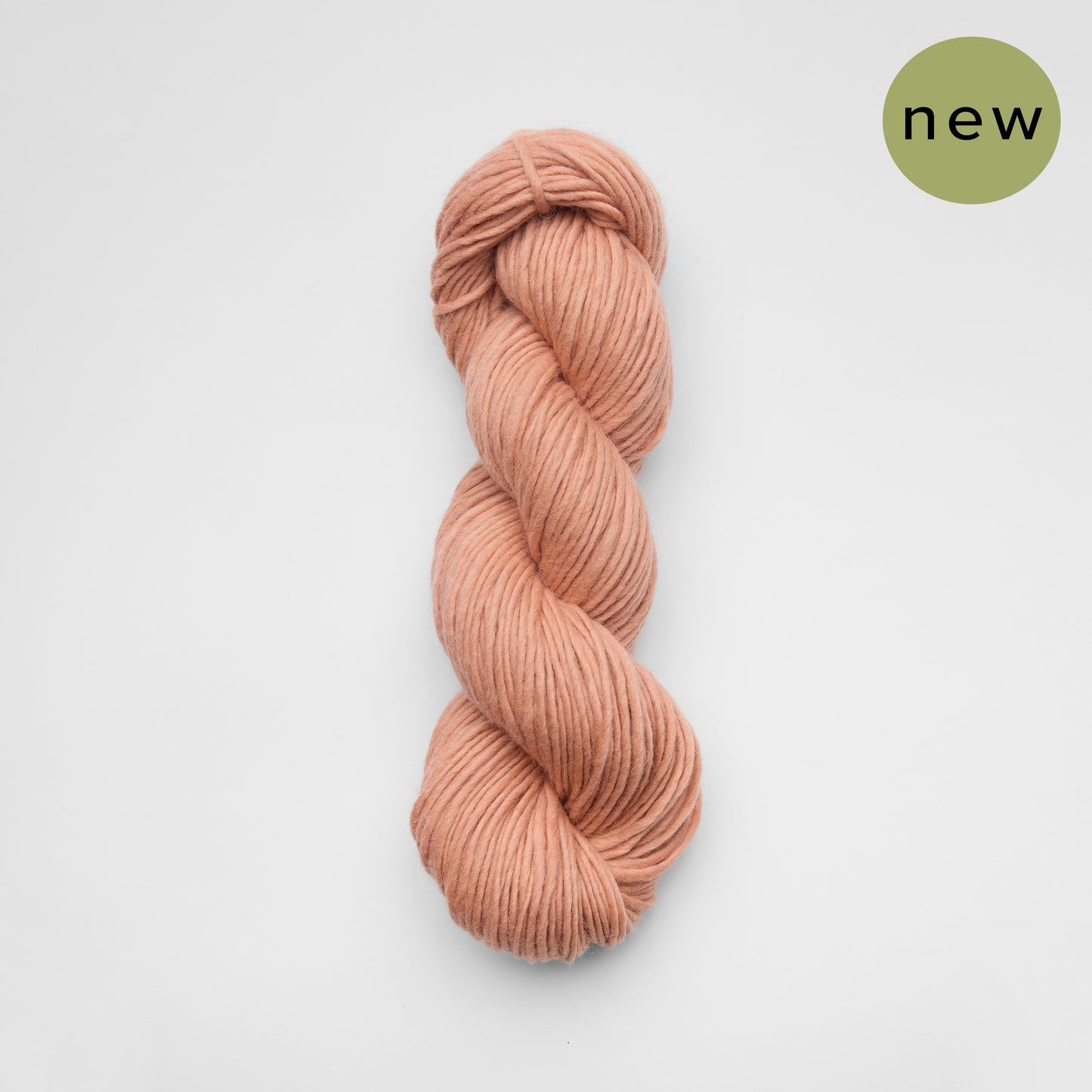 Kinua The Skinny Luxury Blend yarn in soft pink and beige shades, showcasing its smooth texture and vibrant color variation.
