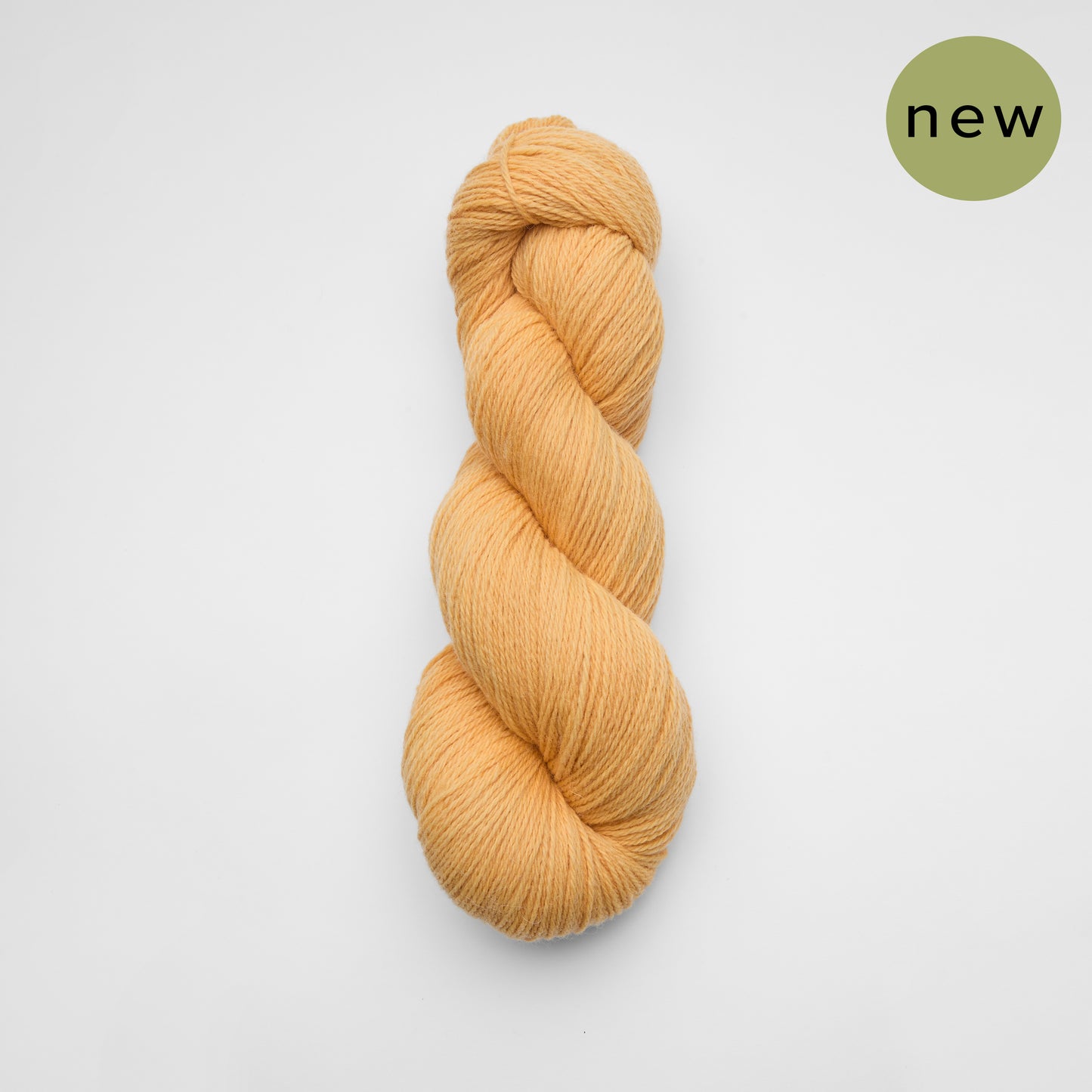 Soft, luxurious fingering yarn from Kinua's Luxury Blend line, shown in natural light highlighting its smooth texture.