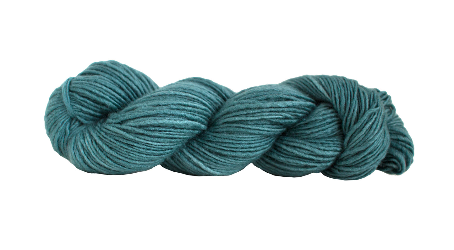 Steel-colored silk blend yarn by Manos del Uruguay, showing a soft, shiny skein with smooth texture and subtle sheen.