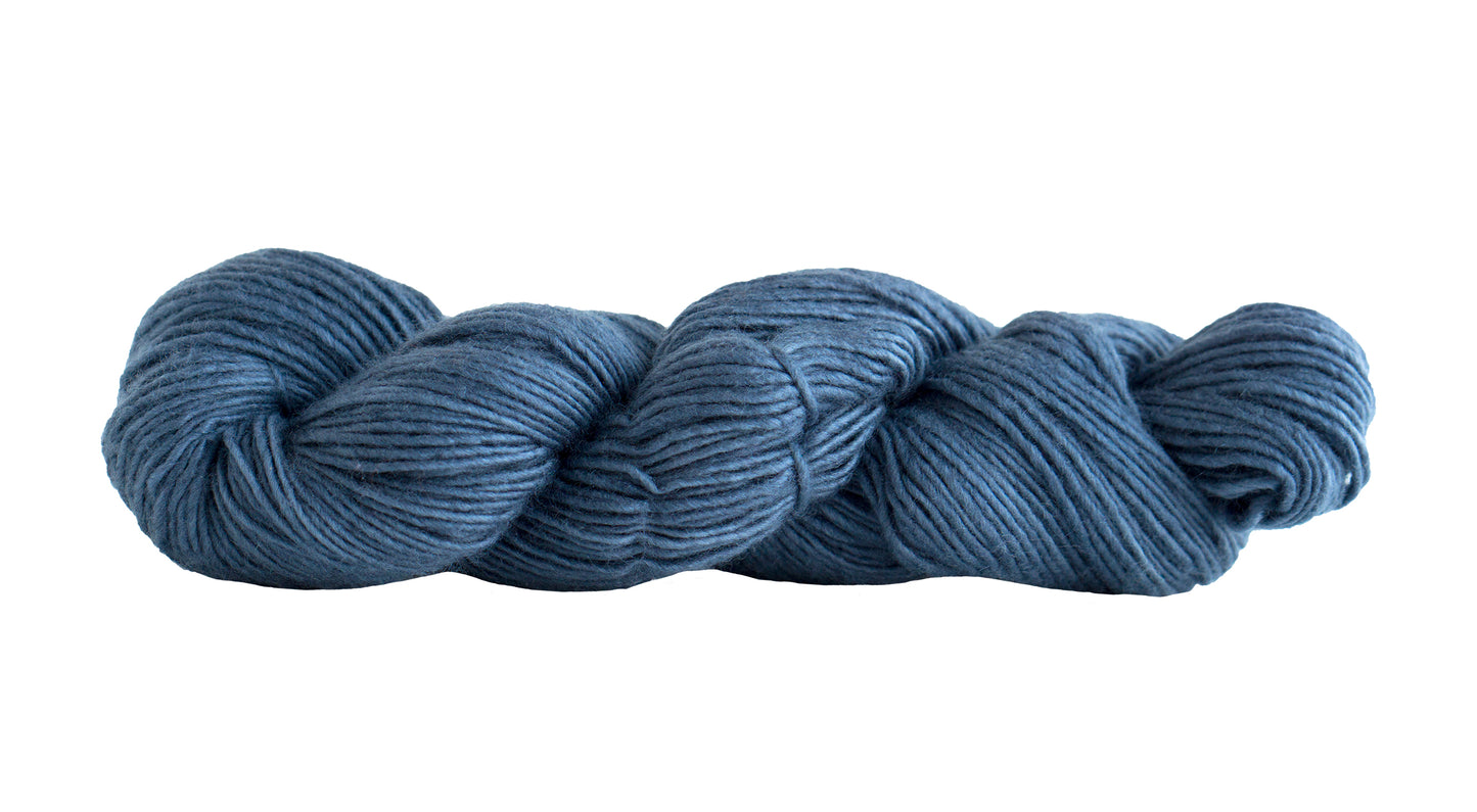 Manos del Uruguay Silk Blend yarn in Pewter color, showing soft, shiny silk and wool fibers twisted together for knitting or crochet.