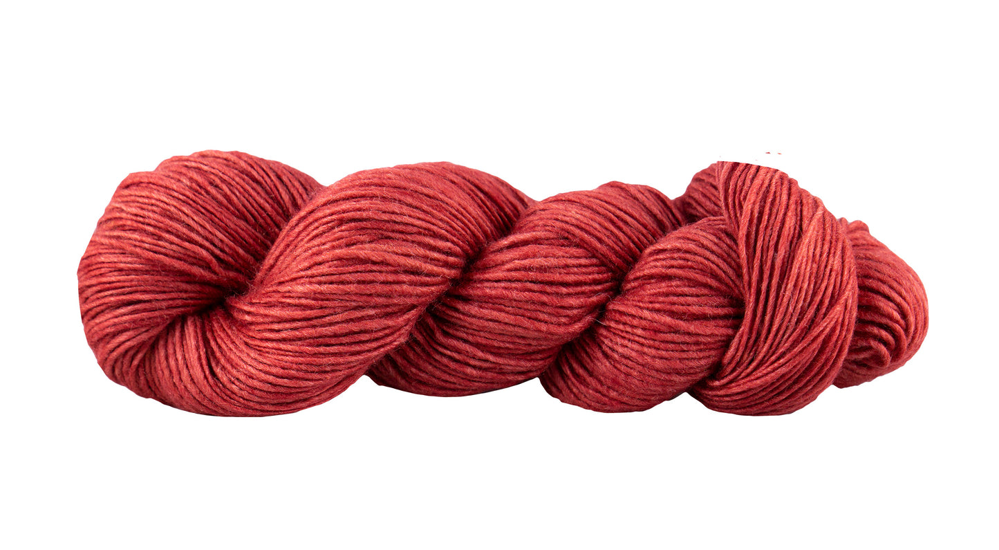 Manos del Uruguay Silk Blend yarn in Clafoutis color, showing soft, luxurious fiber with a rich, vibrant hue.