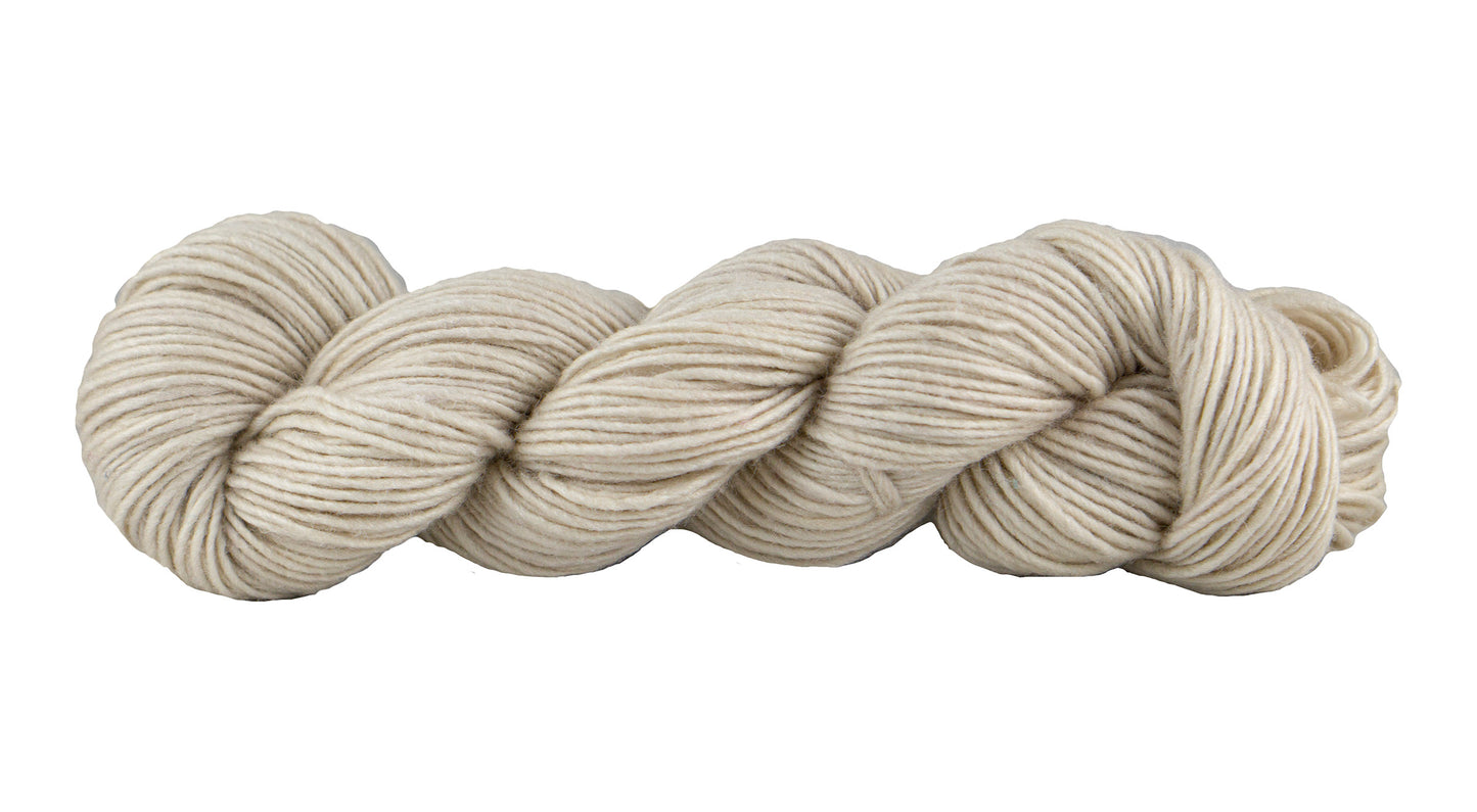 Soft silk blend yarn from Manos del Uruguay in a putty color, showcasing its smooth texture and luxurious appearance.