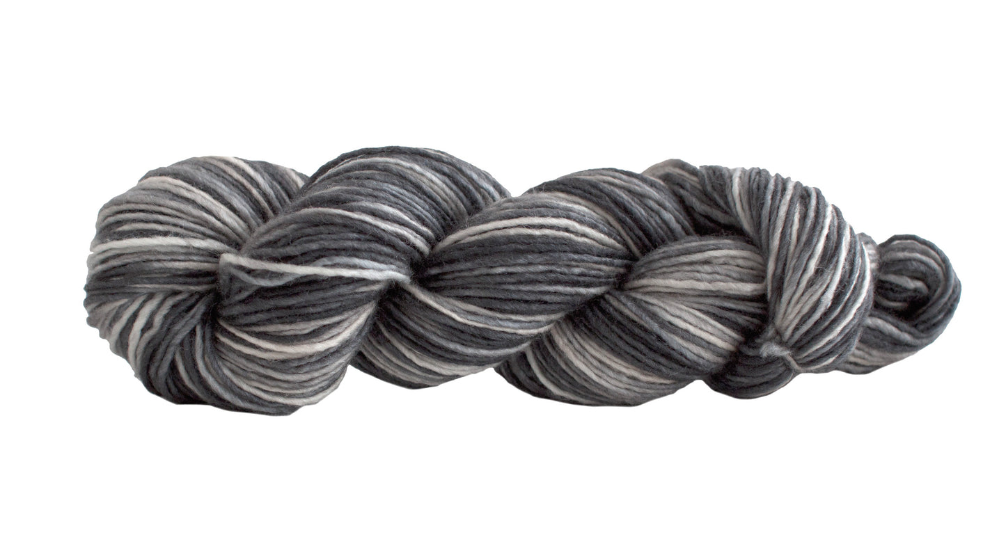 Manos del Uruguay Silk Blend yarn in Zebra colorway, showcasing soft, luxurious silk and wool fibers with striped pattern.