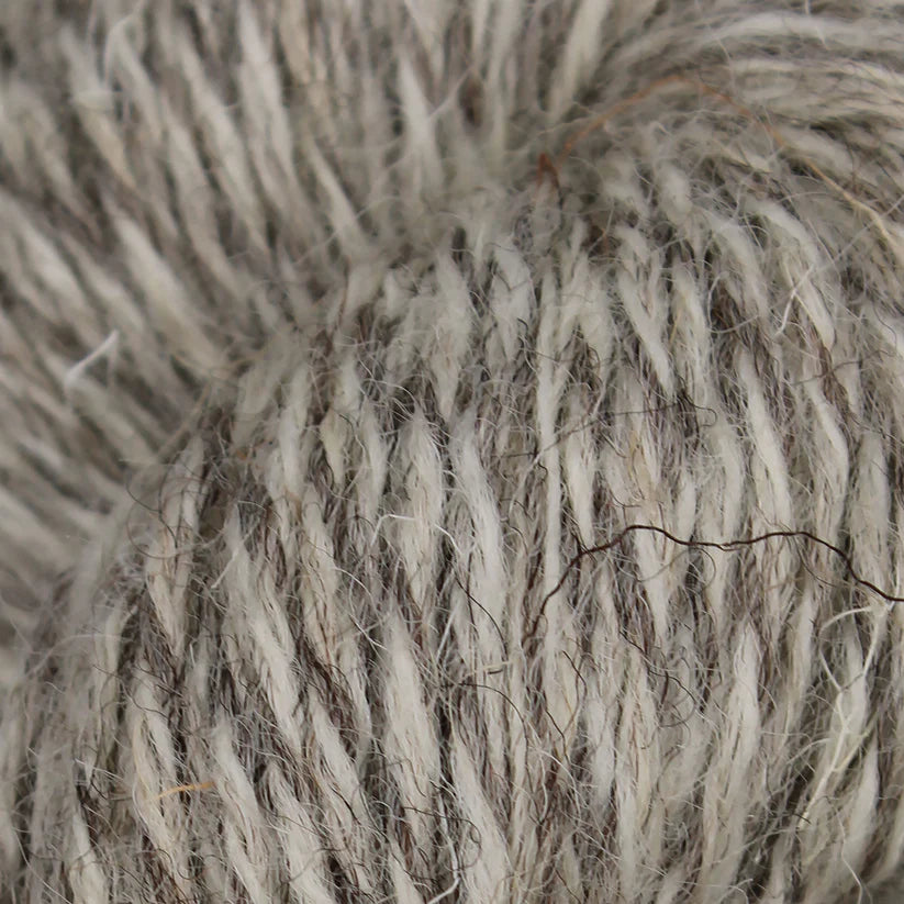 British Breeds Baa Ram Ewe yarn in light natural twist, showcasing soft, natural-colored wool fibers perfect for knitting projects.