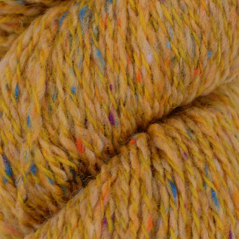 Baa Ram Ewe Donegal Twists yarn in natural shades, showcasing the textured, twisted fiber with a subtle speckled finish.