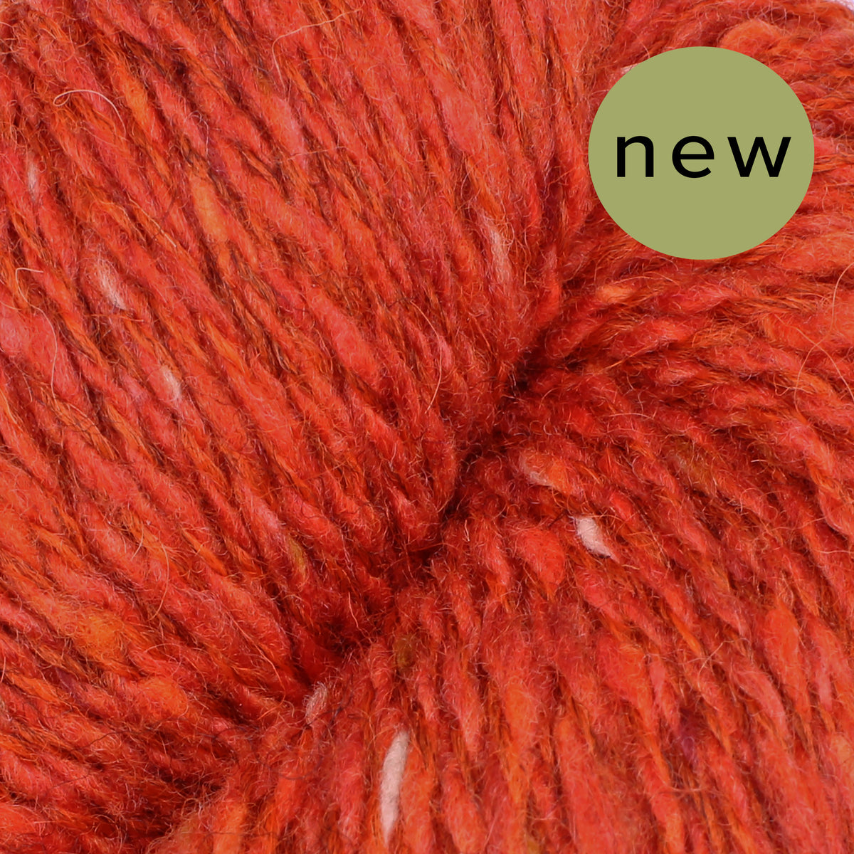 Baa Ram Ewe Donegal Twists yarn in natural beige with textured, twisted fibers, ideal for knitting or crochet projects.