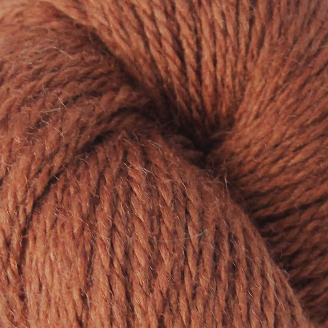 Baa Ram Ewe Woodnote DK yarn in Conker, showcasing soft, warm yarn with rich brown color and smooth texture.