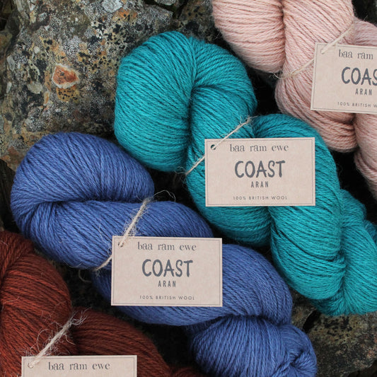 Baa Ram Ewe Coast yarn in soft, natural fibers, displayed in a close-up showcasing its texture and versatile color.