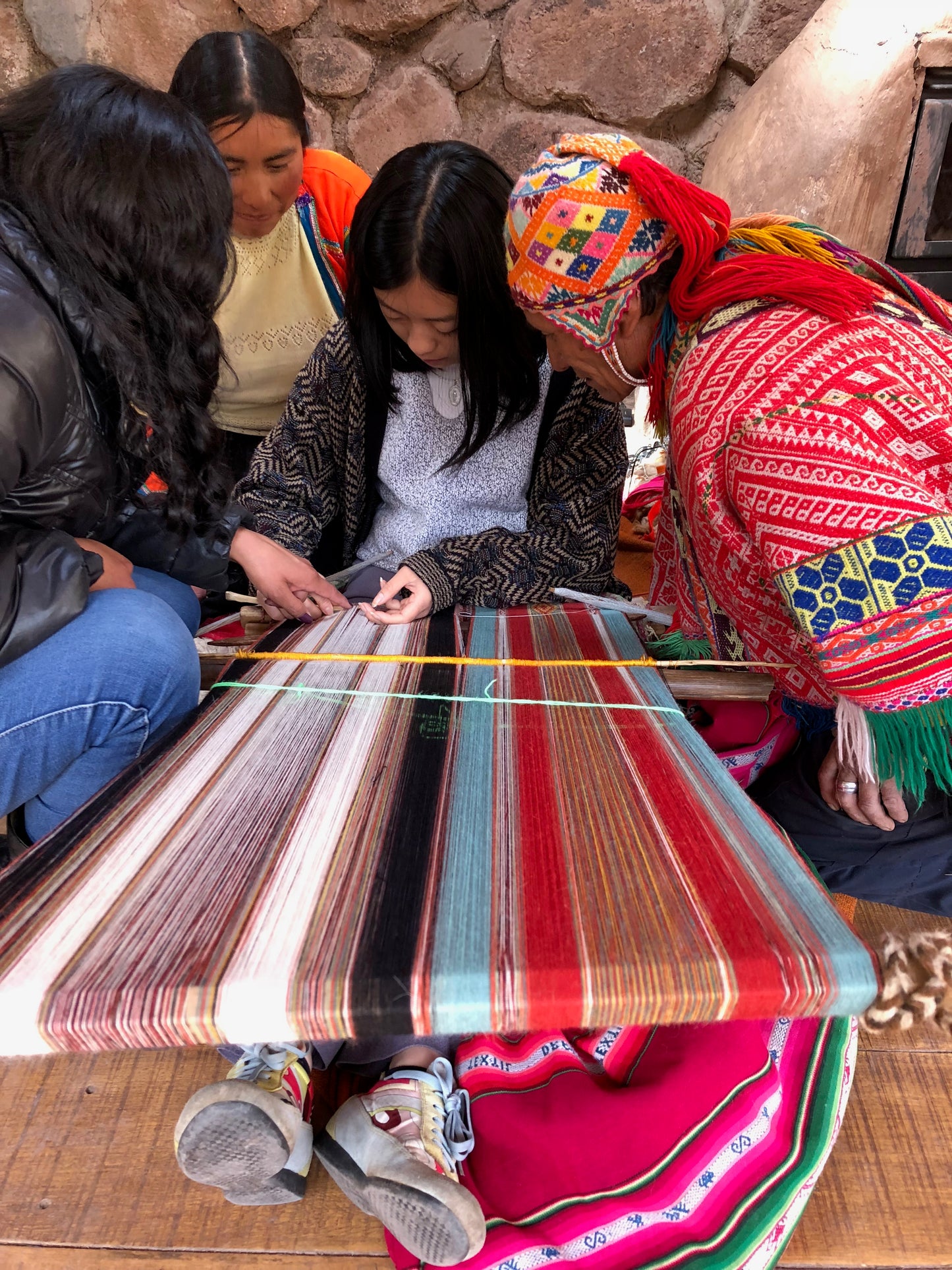 Fairmount Fibers Peruvian Textile Tour 2027 deposit slip showing detailed textile patterns and vibrant colors.