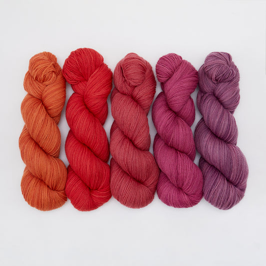 Kinua The Fingering Luxury Blend yarn in soft, vibrant colors, showcasing its smooth texture and fine, high-quality fiber.