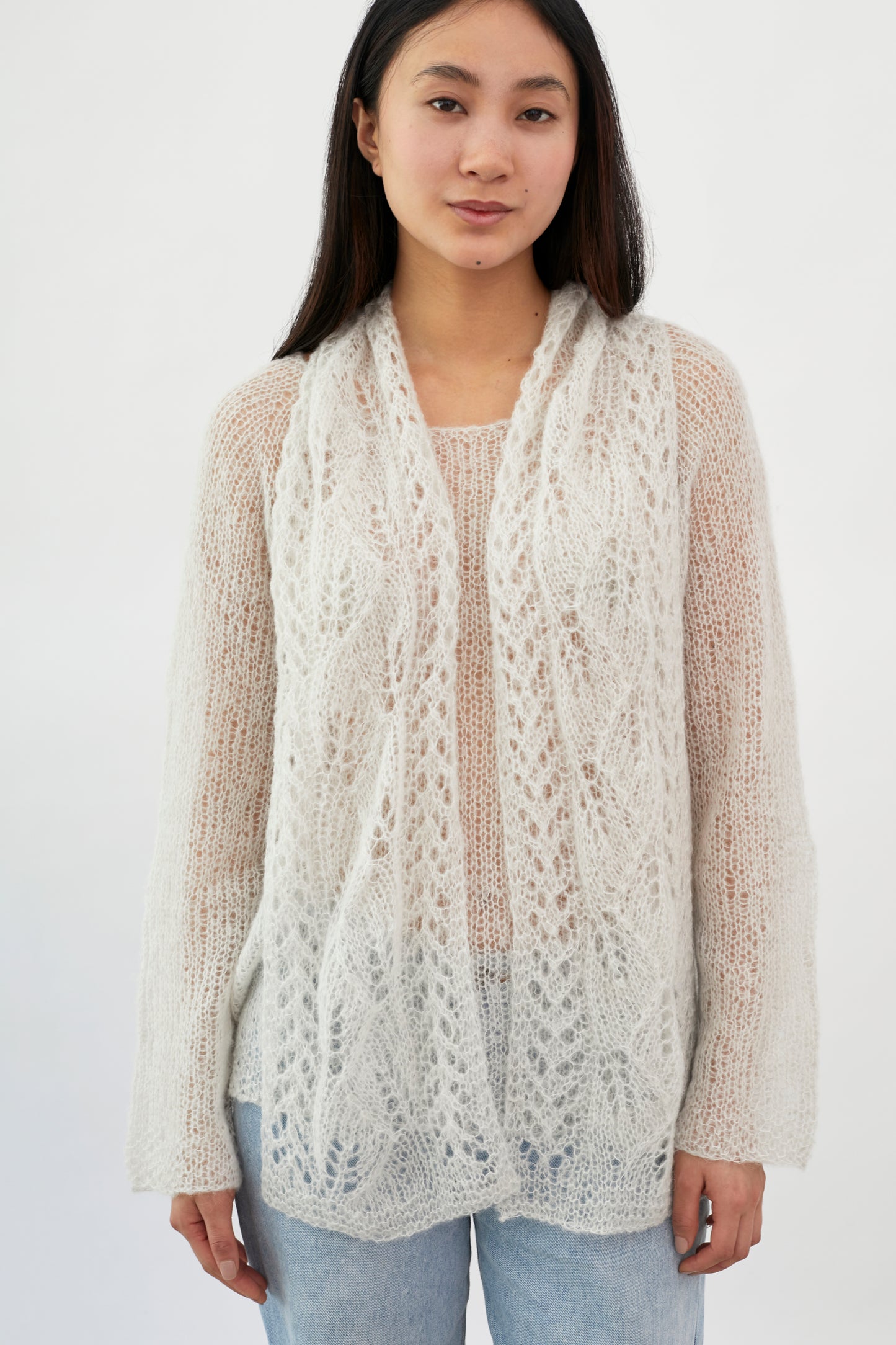 Fuzzy patterned scarf by Kinua featuring soft, cozy fabric with a stylish design, perfect for adding warmth and style.