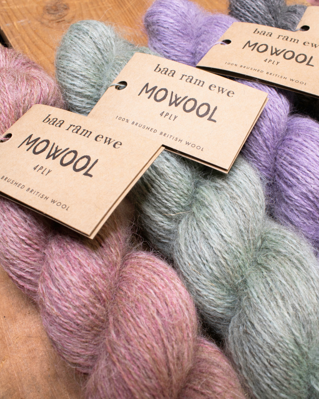 Baa Ram Ewe Mowool yarn in natural wool color, soft and thick, shown in a close-up image highlighting its texture and fiber details.