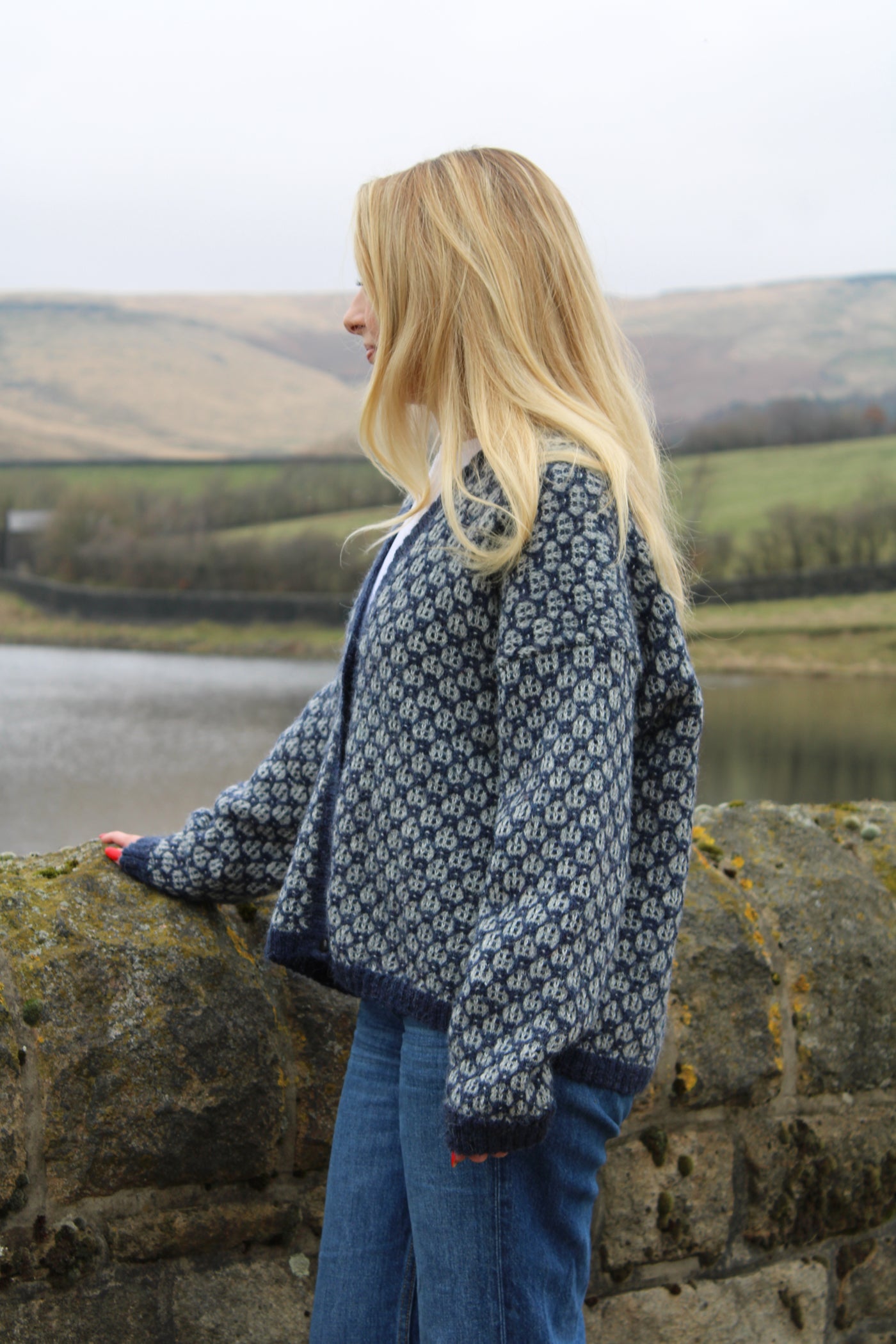 Close-up of Baa Ram Ewe Odette pattern knitted swatch showcasing intricate design details and soft yarn texture.
