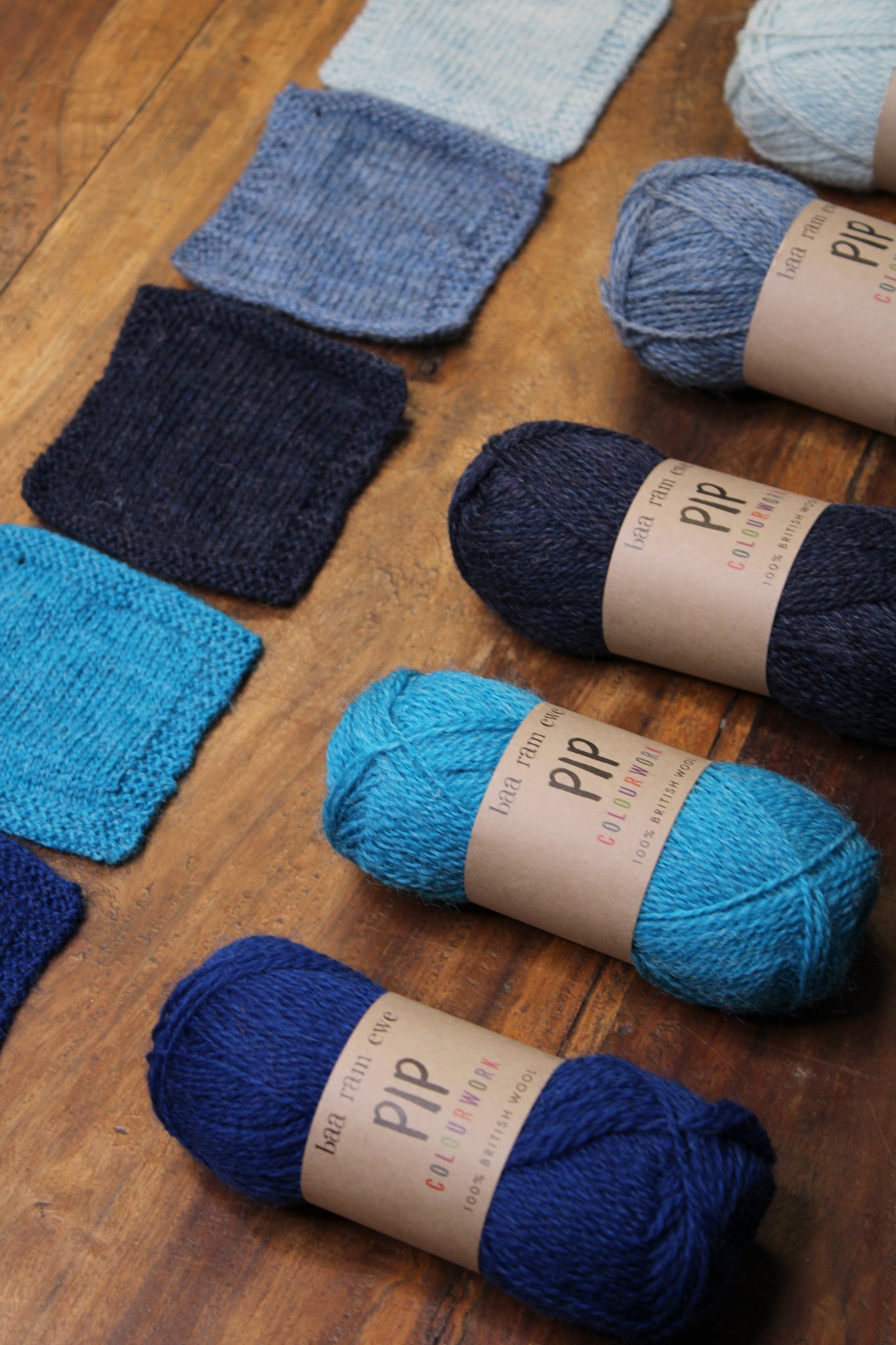 Blue palette of Pip Colourwork yarn by Baa Ram Ewe, showcasing soft, variegated wool yarn in shades of blue.