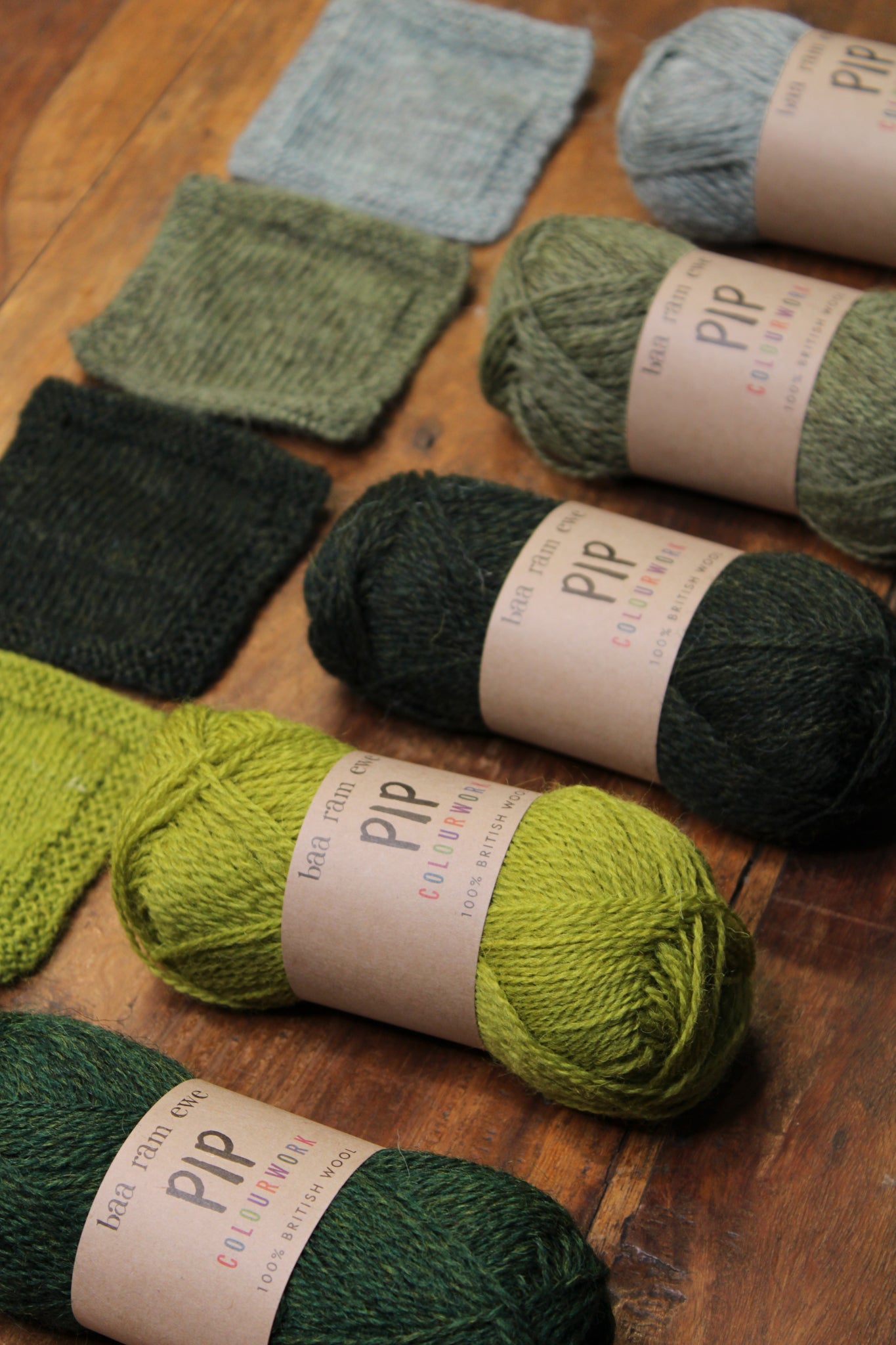 Baa Ram Ewe Pip Colourwork yarn in vibrant green palette, showcasing soft, colorful wool yarn for knitting or crochet projects.