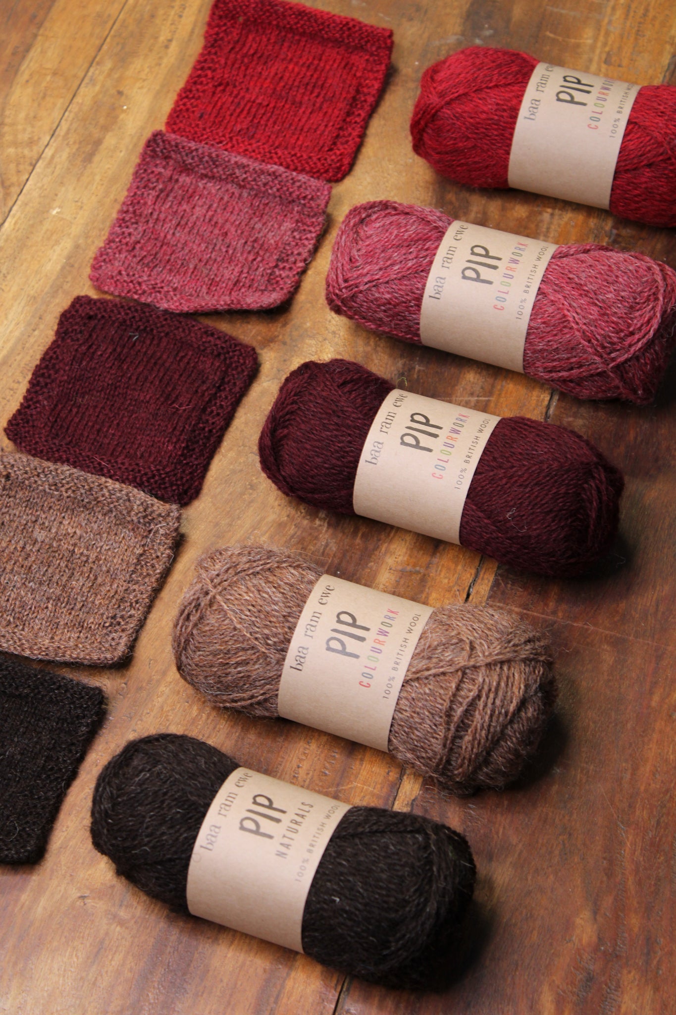 Baa Ram Ewe Pip Colourwork yarn in vibrant red palette, showcasing soft, textured wool for knitting and crochet projects.