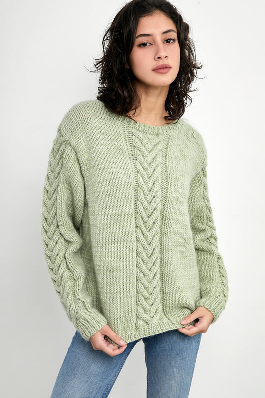 Kinua Monet Sweater in aqua color featuring a vibrant pattern and soft knit texture, perfect for stylish layering.
