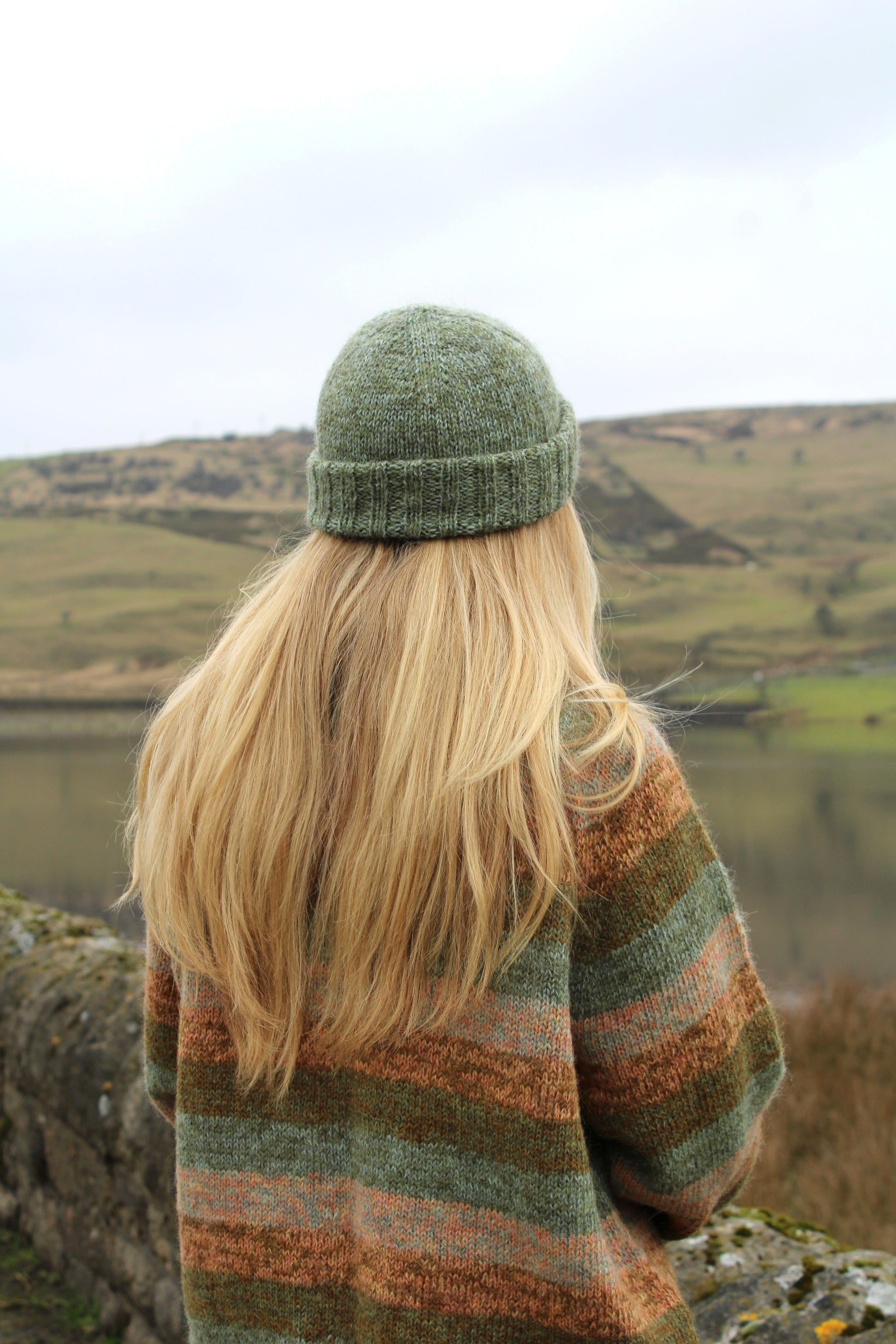 Close-up of the Wren Hat and Cowl pattern by Baa Ram Ewe, showcasing the intricate knitting design and soft yarn textures.