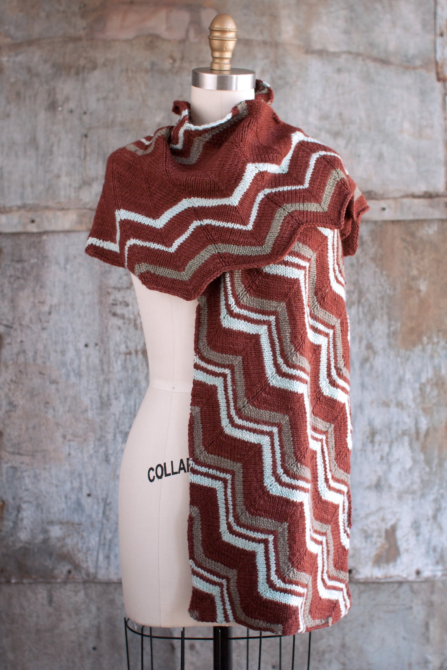 Close-up of Fairmount Fibers Virgule 2015N pattern yarn in natural shades, showcasing intricate design and texture.
